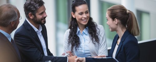 businesspeople-having-discussion-in-office